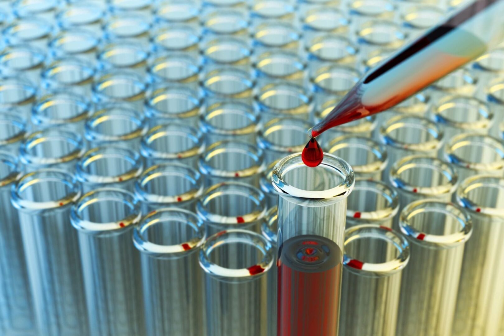 A person is pouring liquid into a test tube.